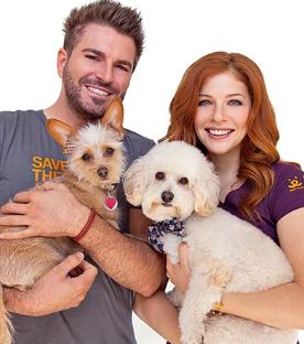 Rachelle Lefevre and her husband with their dogs.