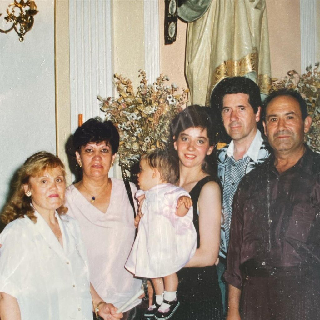 Young Veki Velilla with her mother and grandparents during her baptism