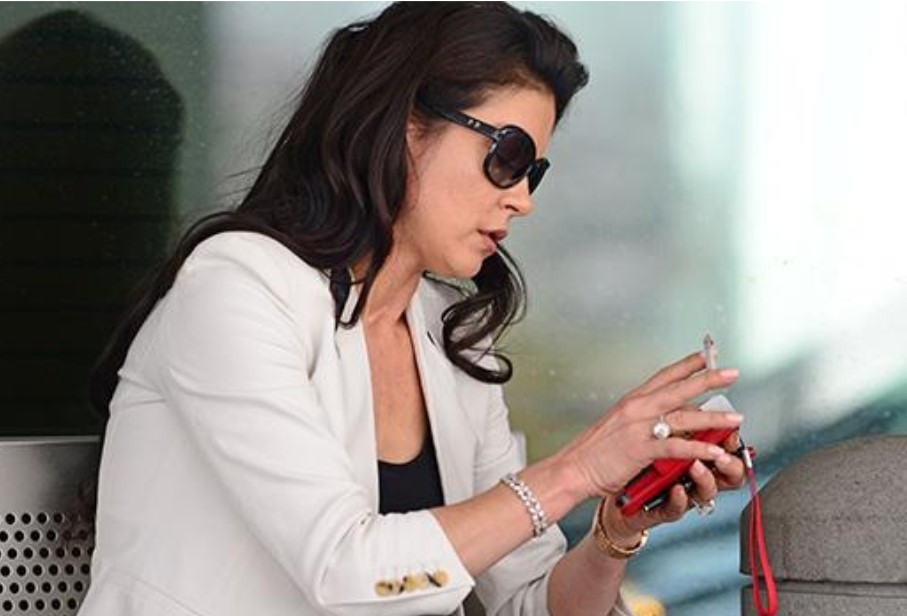 Catherine Zeta-Jones was spotted smoking outside the airport. 